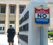 Large NO TRESPASSING sign faces Christians